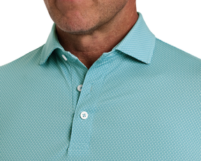 The Hicks Shirt: Harbor features a geometric pattern, classic collar, white buttons, and offers performance with moisture wicking, breathability, and sun protection.