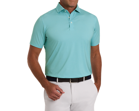 The Hicks Shirt: Harbor displayed on a male torso, features a geometric golf-tee microprint, stretchable fabric, structured collar, highlighting its performance and sun protection qualities.