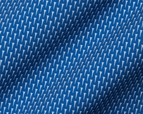 Close-up of The Hicks Shirt: Maidstone Blue, featuring a blue jersey fabric with white geometric motifs, showcasing its soft texture and structured collar.