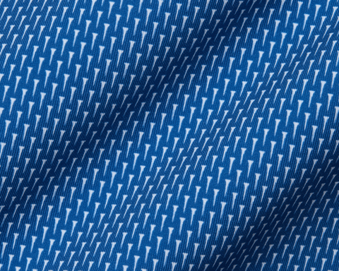 Close-up of The Hicks Shirt: Maidstone Blue, featuring a blue jersey fabric with white geometric motifs, showcasing its soft texture and structured collar.