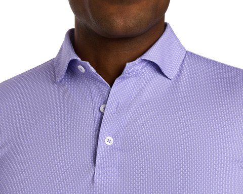 The Hicks Shirt: Tudor features a light purple geometric pattern, short sleeves, and a structured collar, offering breathability and UPF 50+ protection.