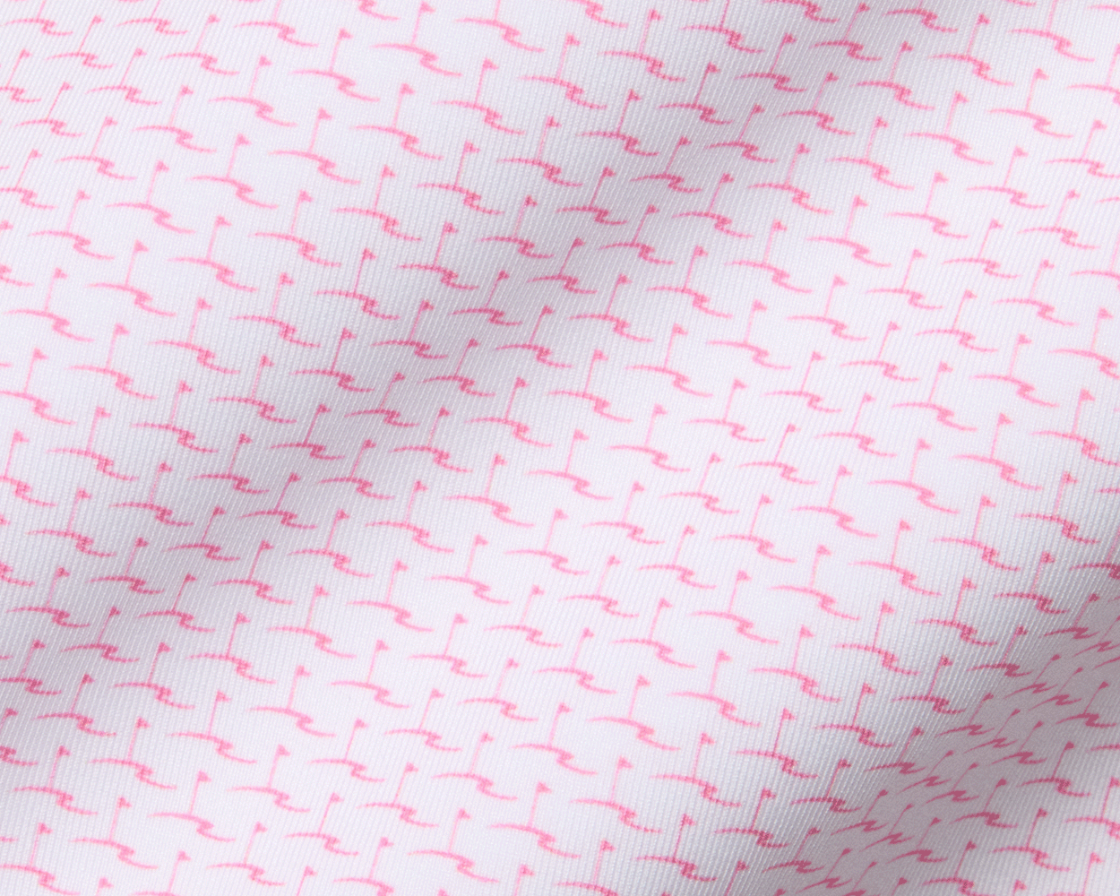 The Atwood Boys Shirt: Belmont features a white fabric with a tiny pink flamingo pattern, offering comfort and protection with performance jersey material.