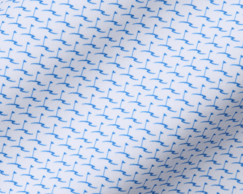 The Atwood Boys Shirt: Horizon Blue features a white woven fabric with a tiny, stylized blue bird motif, offering breathability, moisture-wicking, and UPF 50+ protection.