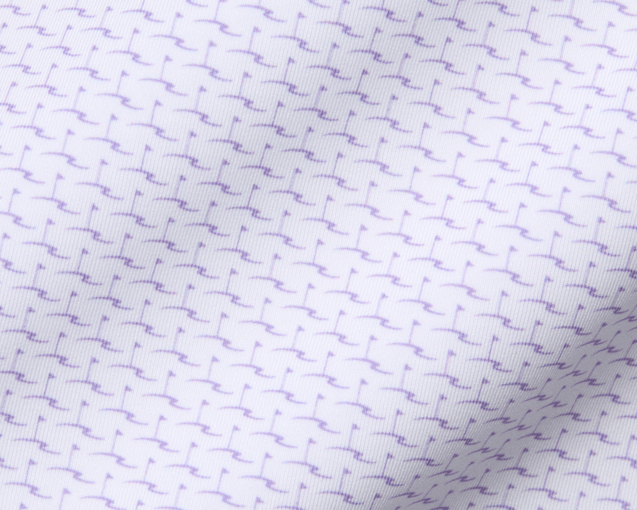 Close-up of The Atwood Shirt: Tudor, showcasing a white fabric with a purple motif pattern, featuring a structured spread collar and signature fit.