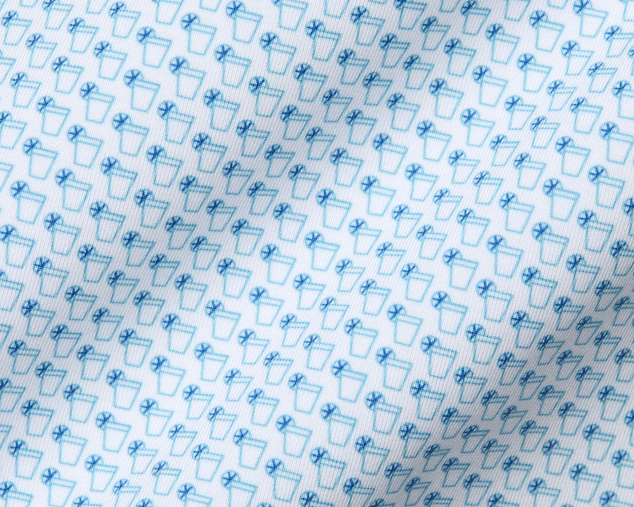The Fulton Shirt: Harbor & Maidstone Blue, showcasing a subtle cocktail pattern with beverage glasses and lemon wheels, crafted from super-soft performance jersey for comfort.