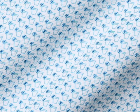 The Fulton Shirt: Harbor & Maidstone Blue, showcasing a subtle cocktail pattern with beverage glasses and lemon wheels, crafted from super-soft performance jersey for comfort.