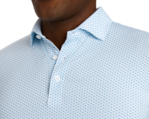 Close-up of The Fulton Shirt: Harbor & Maidstone Blue, featuring a subtle cocktail pattern, pointed collar, white buttons, and soft jersey fabric for comfort and sun protection.