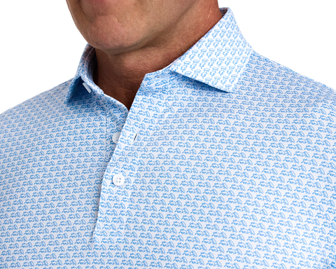 The Berkeley Shirt: Maidstone Blue, featuring a repeating blue rhinoceros motif, a spread collar, and white buttons, ideal for style and comfort.