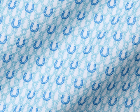 The Rivers Shirt in Harbor & Maidstone Blue features a subtle pattern of alternating dark and aqua-blue horseshoes on soft, stretchy jersey fabric.
