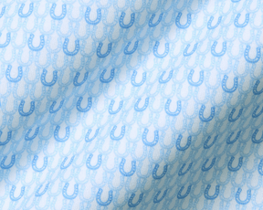 The Rivers Shirt: Vista Blue & Horizon Blue, featuring a soft jersey fabric with light-blue horseshoe motifs on a subtle background, showcasing its breathable, moisture-wicking design.