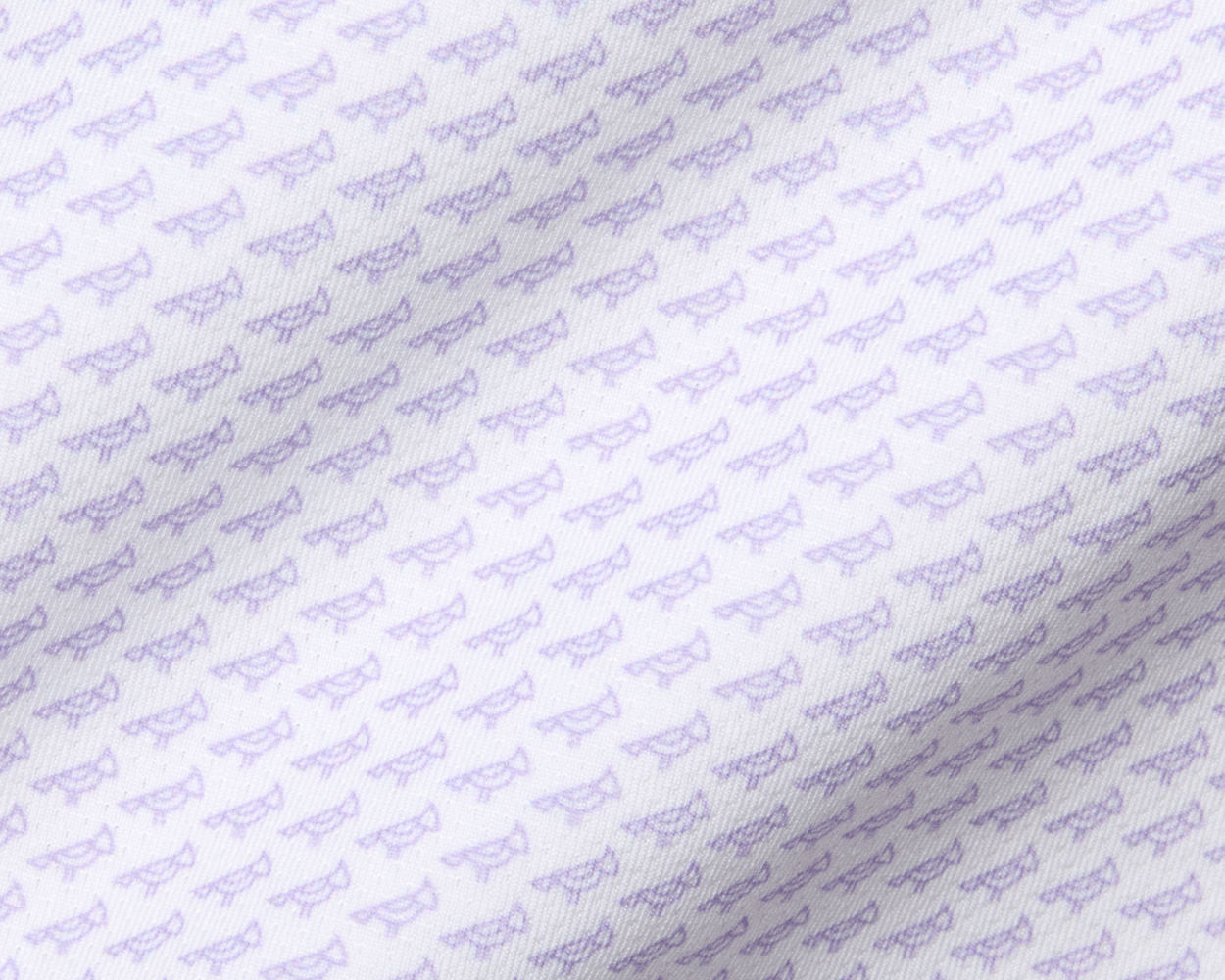 The Walton Shirt: Tudor features a white fabric with pale-purple eyeglass icons, offering breathability and sun protection with its AIRATION® performance material.