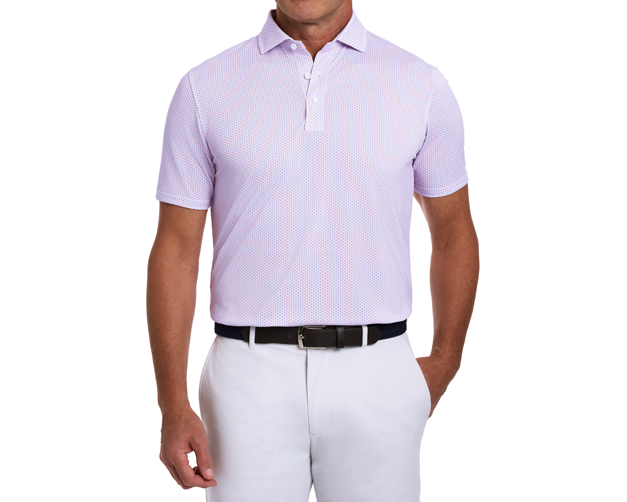 Man wearing The Lennox Shirt: Belmont & Horizon Blue, light-lavender short-sleeve polo with dot pattern, paired with white trousers and a black woven belt.
