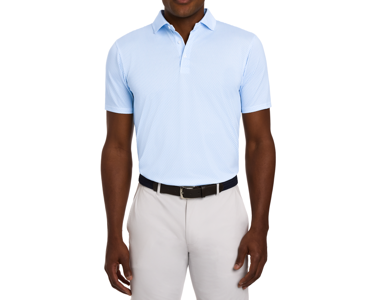 Man wearing The Lennox Shirt in light blue with a star pattern, tucked into light-gray trousers, featuring a black woven belt, on a white background.