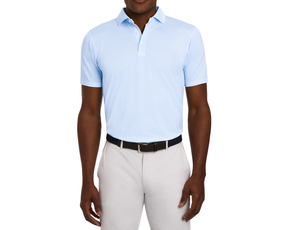 Man wearing The Lennox Shirt in light blue with a star pattern, tucked into light-gray trousers, featuring a black woven belt, on a white background.
