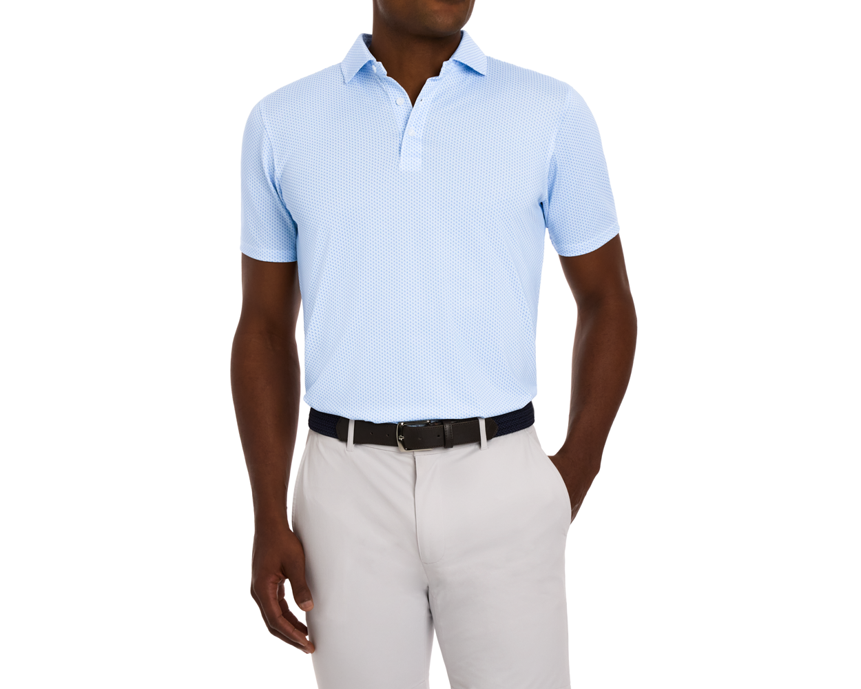 A man wears The Lennox Shirt in Vista Blue & Horizon Blue, a light-blue polo tucked into trousers, showcasing its sophisticated air and performance features.
