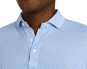 The Geiger Shirt: Maidstone Blue, featuring a blue fan pattern on white, showcases a breathable, moisture-wicking pique fabric with a structured spread collar.