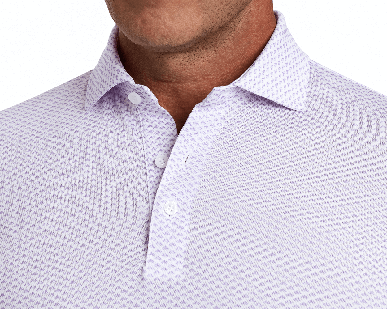 The Geiger Shirt: Tudor features a patterned polo with a structured collar, three-button placket, and breathable pique fabric, offering comfort and UPF 30+ protection.