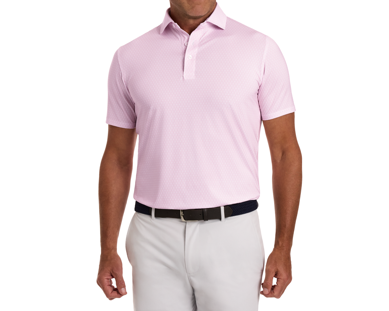 The Griffin Shirt: Belmont features a light pink polo with a subtle griffin pattern, worn by a model with light trousers and a dark woven belt.
