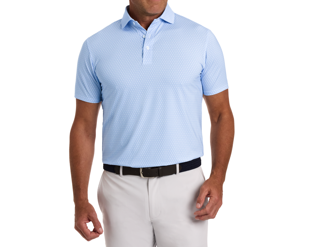 The Griffin Shirt: Horizon Blue on a male model, showcasing a subtle repeating pattern, short sleeves, and a structured collar, paired with light trousers and a woven belt.