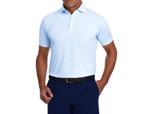 Man wearing The Griffin Shirt: Vista Blue, a light-blue polo with a subtle griffin pattern, paired with dark trousers and a braided belt.