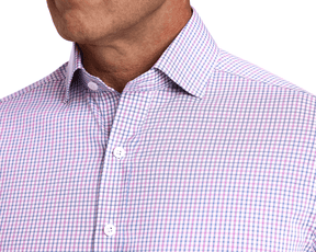 The Wright Shirt: Belmont features a plaid pattern with white, pink, and blue lines, a spread collar, and top buttons, exuding a polished, breathable design.