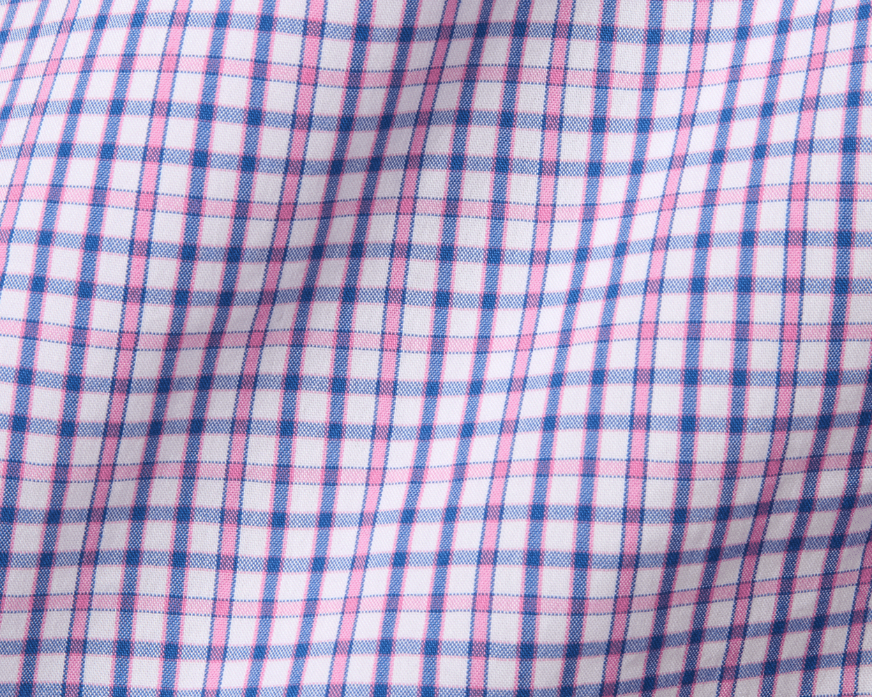 The Wright Shirt: Belmont features a pink and blue plaid pattern on a crisp, breathable cotton-blend poplin, with a structured spread collar and signature fit.