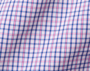 The Wright Shirt: Belmont features a pink and blue plaid pattern on a crisp, breathable cotton-blend poplin, with a structured spread collar and signature fit.