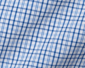 The Wright Shirt: Vista Blue, featuring a blue-and-white plaid pattern, showcases a crisp cotton-blend poplin with moisture-wicking and wrinkle-resistant properties.
