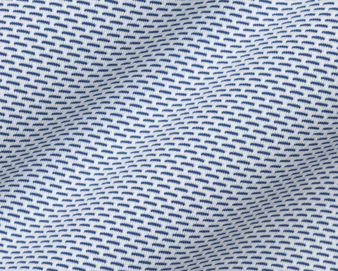 Close-up of The Goodrich Shirt: Pacific Blue showing the repeating blue and white geometric print and soft knit texture.