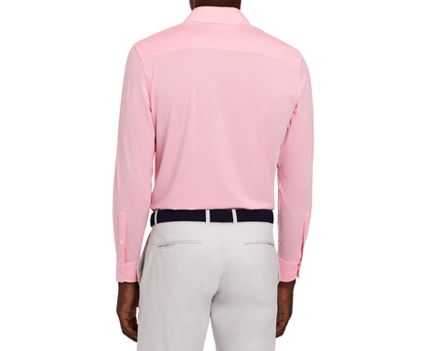 The Goodrich Shirt: Belmont, a collared long-sleeve shirt, worn tucked into trousers, highlighted by a dark navy belt, perfect for versatile styling.