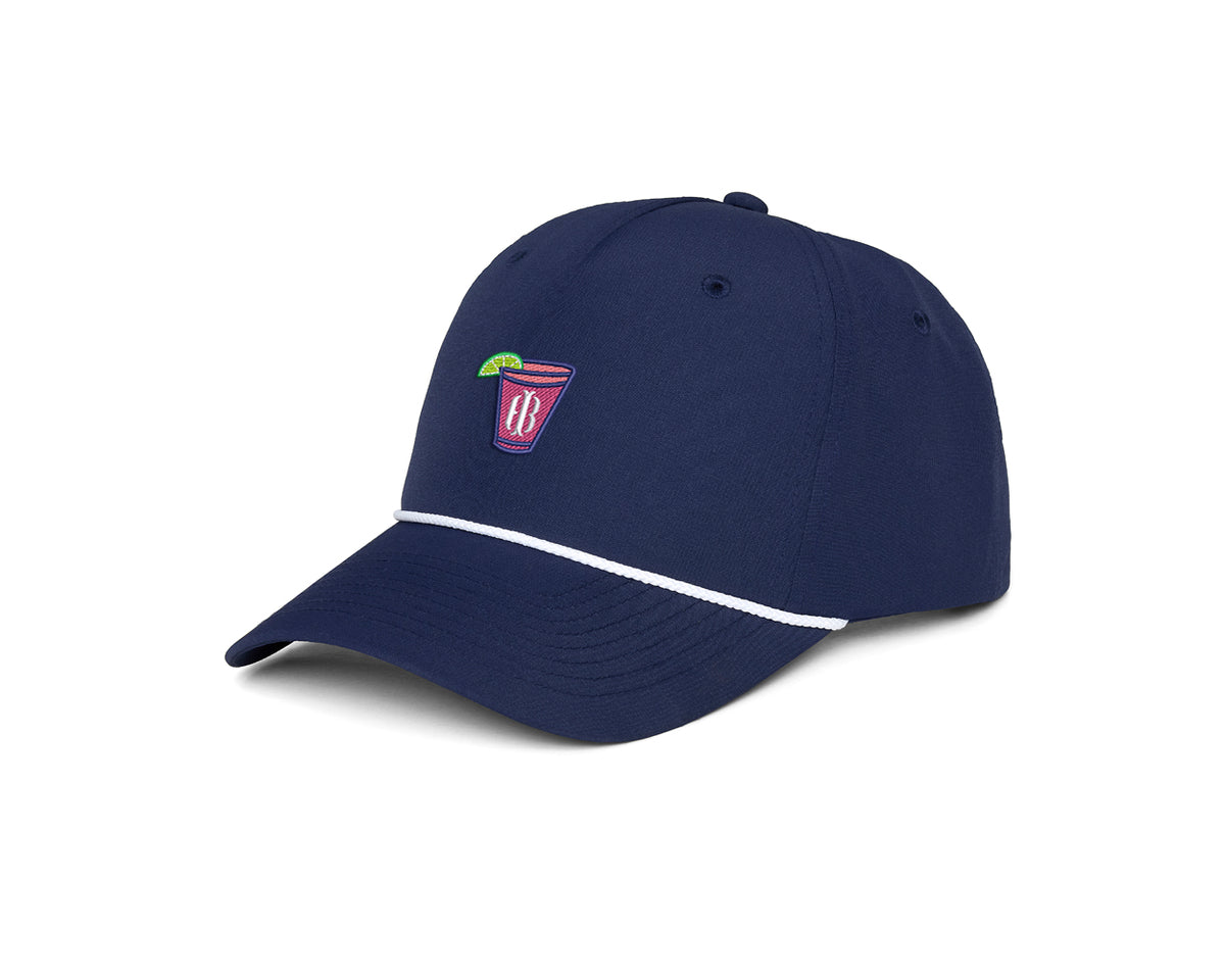 The Performance Rope Hat: Navy with Transfusion Icon features a navy baseball cap with a white rope detail, embroidered cocktail glass, and adjustable snap-back closure.