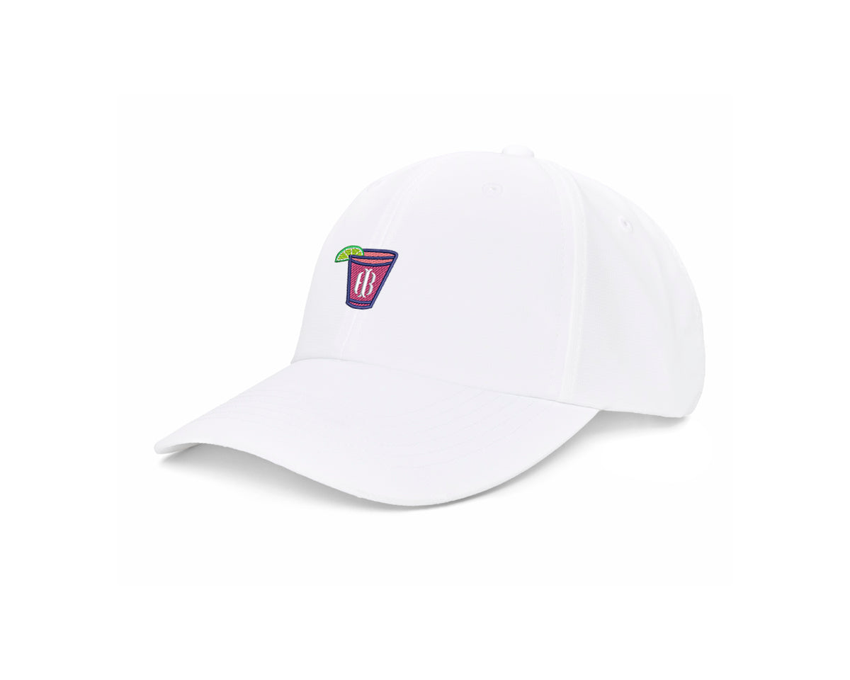 The Lightweight Performance Hat: White with Transfusion Icon features a pink cocktail glass patch and an adjustable fit with UPF 50+ protection.