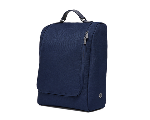 The Rutledge Shoe Bag: Navy Ballistic—a compact, navy-blue travel organizer with a top handle, zippered compartments, leather trim, and gunmetal hardware.