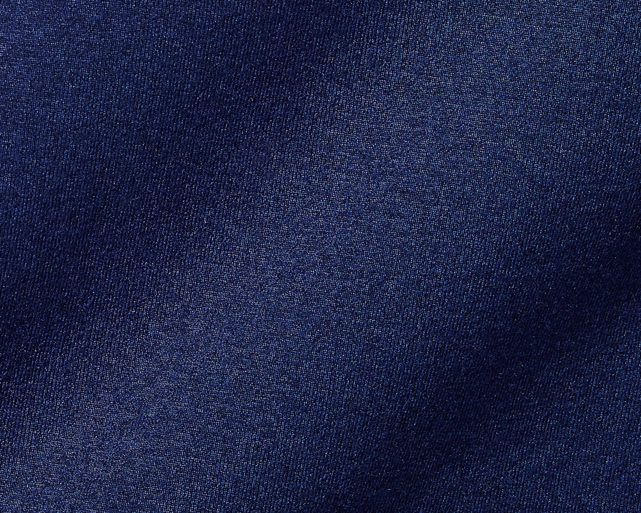 The Westland Boys Quarter-Zip: Navy, showcasing a close-up of its dark navy-blue woven fabric with a subtle sheen and fine, tightly packed threads.