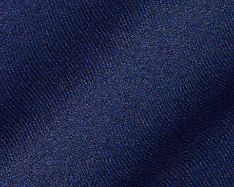 The Westland Boys Quarter-Zip: Navy, showcasing a close-up of its dark navy-blue woven fabric with a subtle sheen and fine, tightly packed threads.