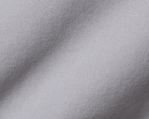 Close-up of The Harwood Boys Short: Gray, highlighting its finely textured, light gray fabric with a gentle fold, emphasizing its softness and performance features.