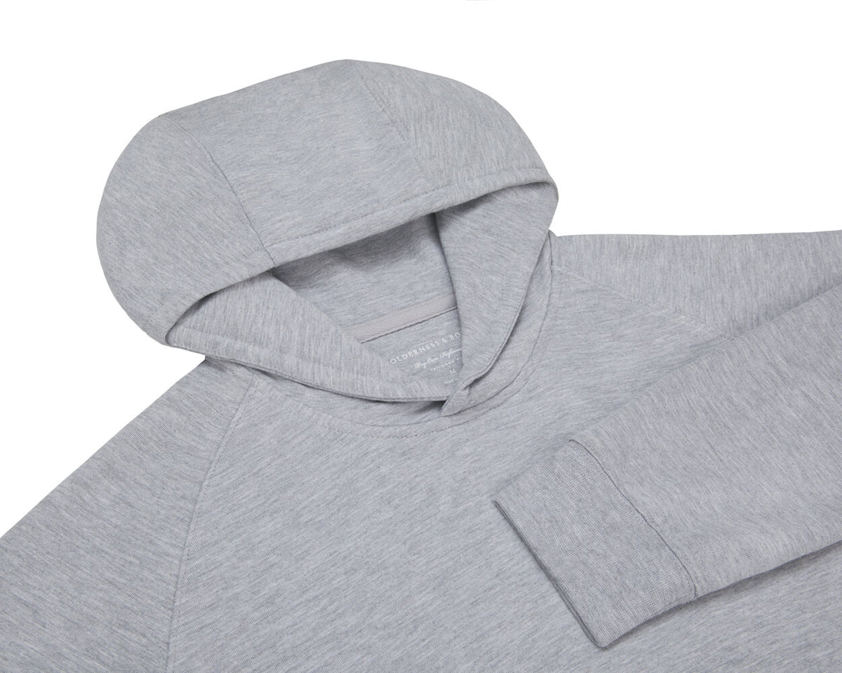 The Lawson Hoodie: Heathered Gray, features a long-sleeve design with a seamless hood and cuffs, crafted for warmth with ultra-soft fabric, minus drawstrings.