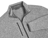 The Ashby Jacket: Heathered Gray, featuring a full-zip design, stand-up sherpa collar, and chest zip-pocket, offers versatile comfort with its buttery soft interior.