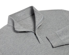 The Harper Quarter-Zip: Heathered Gray pullover features a soft, fleecy interior, standing collar, ribbed cuffs, and a partially open quarter-zip for versatile comfort.