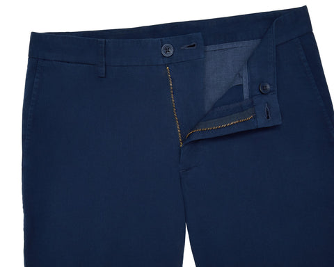The Cameron Short in navy, showcasing the waistband with belt loops, button closure, and partially unzipped zipper fly, highlighting its premium cotton/stretch twill fabric.