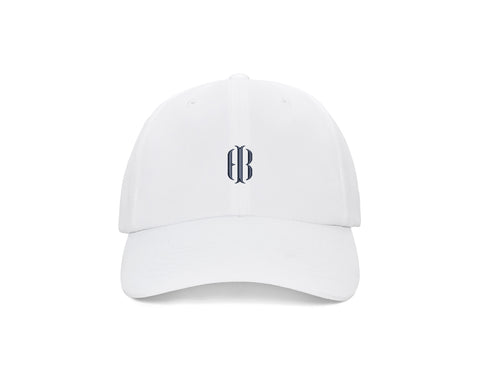 The Lightweight Performance Hat: White with HB Icon, featuring a gothic-style logo, adjustable closure, and UPF 50+ protection, perfect for outdoor activities.