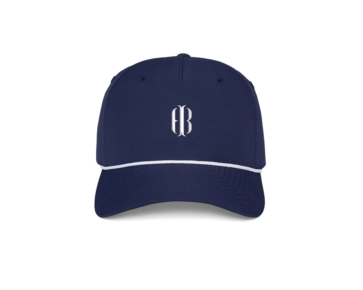 The Performance Rope Hat: Navy with HB Icon features a navy-blue design, white rope accent, monogram on front, UPF 50+ protection, and adjustable snap-back closure.