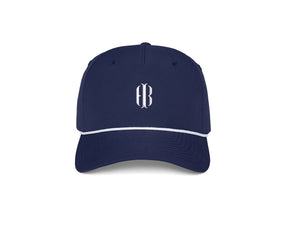 The Performance Rope Hat: Navy with HB Icon features a navy-blue design, white rope accent, monogram on front, UPF 50+ protection, and adjustable snap-back closure.