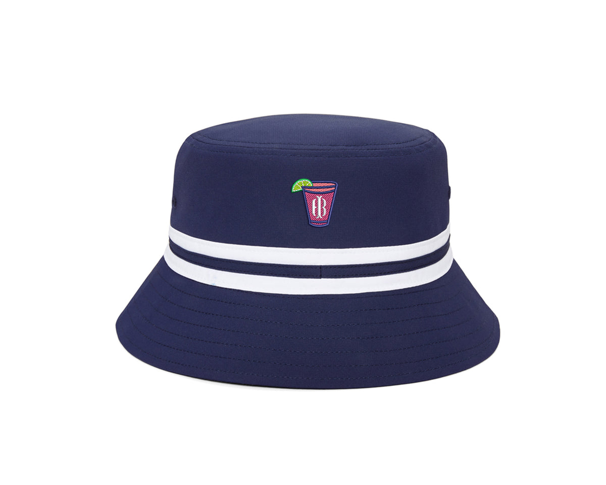 The Lightweight Bucket Hat: Navy with Transfusion Icon features a pink cocktail patch, two white stripes, and offers UPF 50+ sun protection.