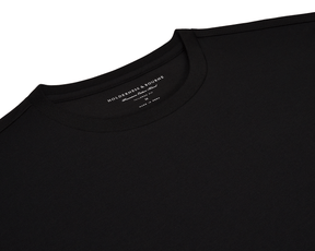 The Mason T-Shirt: Black, features a plain crew-neck design with a visible Holderness & Bourne label, highlighting its tailored fit and premium cotton blend.