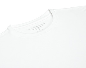 The Mason T-Shirt: White, featuring a tailored fit and premium Peruvian pima cotton blend, laid flat with visible inner neck label details.