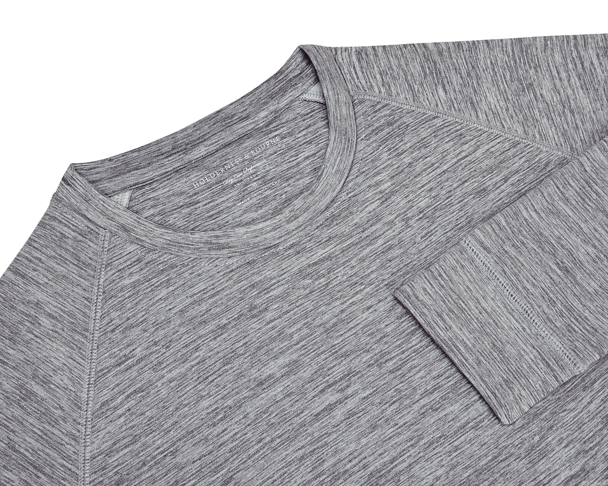 The Laidlay Crewneck: Heathered Gray, featuring a close-up of its raglan sleeve seam, cuff, and faint Holderness & Bourne label near the collar.