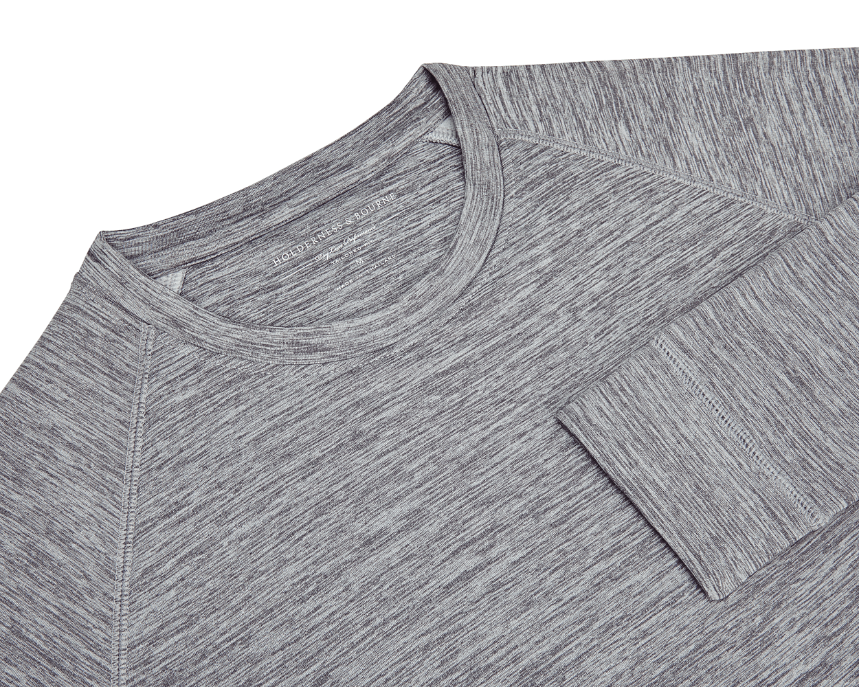 The Laidlay Crewneck: Heathered Gray, featuring a close-up of its raglan sleeve seam, cuff, and faint Holderness & Bourne label near the collar.