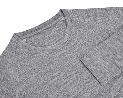 The Laidlay Crewneck: Heathered Gray, featuring a close-up of its raglan sleeve seam, cuff, and faint Holderness & Bourne label near the collar.