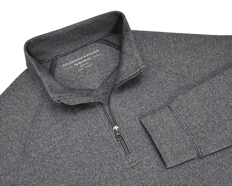 The Westland Boys Quarter-Zip: Charcoal, featuring a heathered design, stand-up collar, and quarter-length zipper, offering UPF 50+ protection and 4-way stretch for comfort.